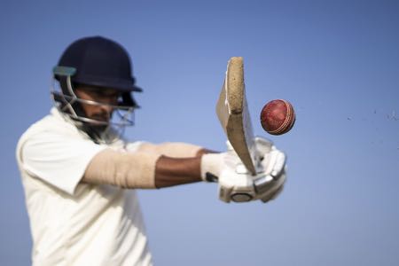 Hitting ball with a cricket bat