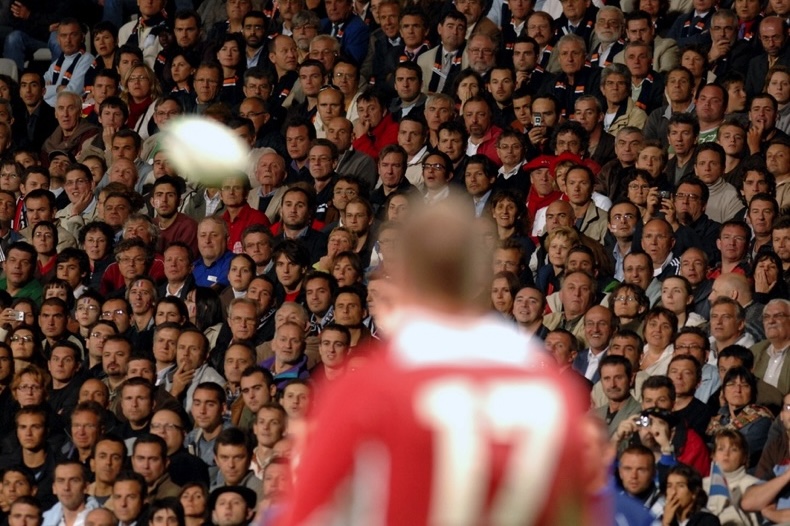 Rugby fans watching a rugby match