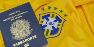 Brazillian passport next to football shirt