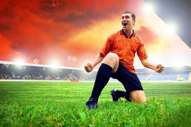 Happy Football Player on Pitch