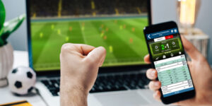 Man betting on football on smartphone