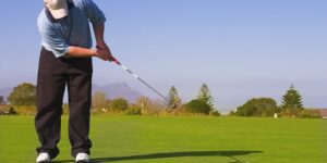 Man playing golf for first time