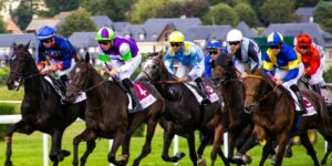 Multiple Horses Running in Race