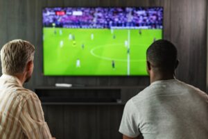 Friends watching football