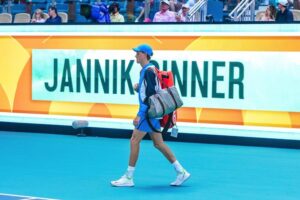 Jannick Sinner walking across court