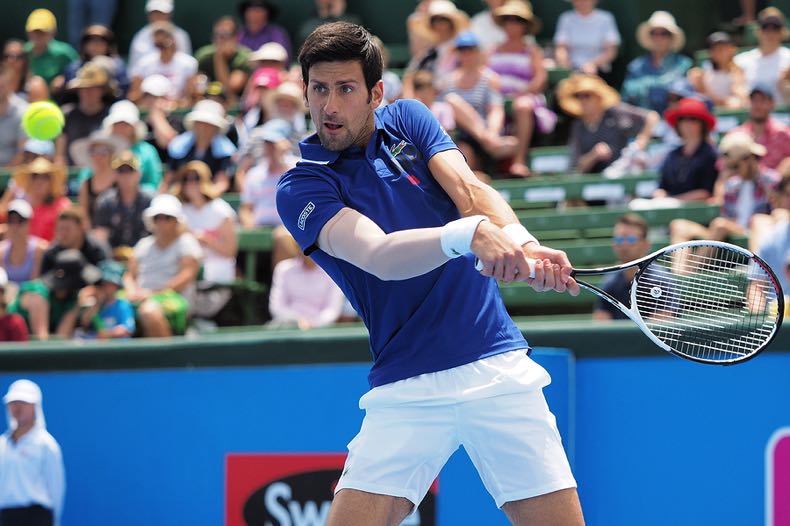 Novak Djokovic swinging tennis racket