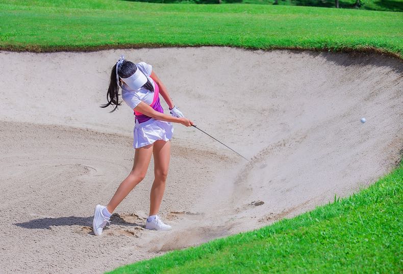 Golfer in the sand pit